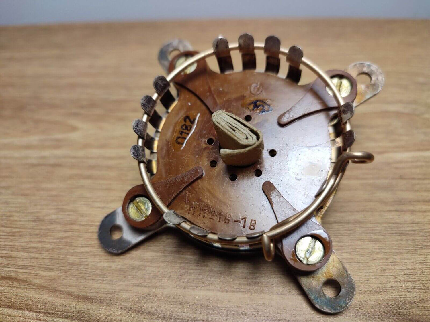 Close-up of a vintage ham radio component featuring a metallic base and coil, ideal for amateur radio projects.