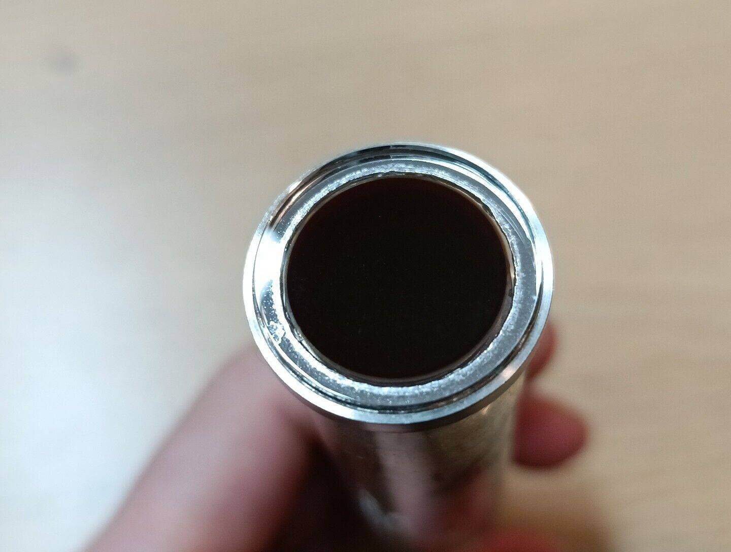 Close-up view of the end of a vintage Russian Vidicon tube LI422-2, showcasing its metallic finish and inner structure.